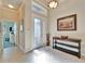 Welcoming foyer features tile flooring, a decorative front door, and direct views into another room at 16135 Cape Coral Dr, Wimauma, FL 33598