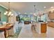 Open concept living area seamlessly integrates the kitchen, dining, and living spaces for easy living at 16135 Cape Coral Dr, Wimauma, FL 33598
