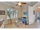 Bright office with a daybed, perfect for relaxation, and shutters for natural light control at 16135 Cape Coral Dr, Wimauma, FL 33598