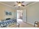 Versatile office space featuring a daybed, a view of the home entrance, and tile flooring at 16135 Cape Coral Dr, Wimauma, FL 33598