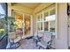 Relaxing patio with comfortable seating, beautiful brick pavers, and a tranquil view through sliding glass doors at 16135 Cape Coral Dr, Wimauma, FL 33598