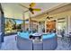 Expansive screened lanai with outdoor seating and lush views, perfect for entertaining or relaxing outdoors at 16135 Cape Coral Dr, Wimauma, FL 33598