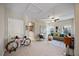 Inviting living room featuring a ceiling fan, modern décor, and a comfortable seating area with a nearby bicycle at 2614 W Horatio St # 1, Tampa, FL 33609