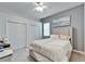 Cozy bedroom with neutral tones, carpet, a ceiling fan, and double closets for ample storage at 2903 Marble Crest Dr, Land O Lakes, FL 34638