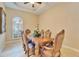 An elegant dining room featuring a decorative ceiling and a large wooden table perfect for entertaining at 2903 Marble Crest Dr, Land O Lakes, FL 34638