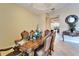 The dining room features ornate wood furniture, stylish décor, and an inviting atmosphere for memorable meals at 2903 Marble Crest Dr, Land O Lakes, FL 34638