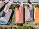 Aerial view of homes displaying terracotta colored rooftops and well manicured lawns at 4822 Grand Banks Dr, Wimauma, FL 33598