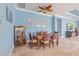 Cozy dining room featuring a wooden table set, elegant decor, and tiled floors at 4822 Grand Banks Dr, Wimauma, FL 33598