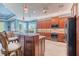 Bright kitchen features granite countertops, stainless steel appliances and center island seating at 4822 Grand Banks Dr, Wimauma, FL 33598