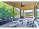 Charming screened patio surrounded by lush greenery, providing a private and peaceful retreat at 4822 Grand Banks Dr, Wimauma, FL 33598
