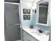 Updated bathroom boasting a glass-enclosed shower and contemporary fixtures at 5108 Brittany S Dr # 204, St Petersburg, FL 33715