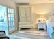 Coastal bedroom showcasing a decorative armoire and a glimpse into the living area at 5108 Brittany S Dr # 204, St Petersburg, FL 33715