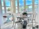 Bright dining area with water views, complemented by a round table, and seating for four at 5108 Brittany S Dr # 204, St Petersburg, FL 33715