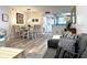 Open concept living and dining area with tile floors and neutral decor creating a bright and spacious living space at 5108 Brittany S Dr # 204, St Petersburg, FL 33715
