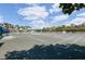 Multiple outdoor tennis courts surrounded by lush greenery and residential buildings at 5108 Brittany S Dr # 204, St Petersburg, FL 33715