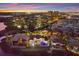 An aerial view of a waterfront neighborhood, with a marina and cityscape in the background at 705 Riviera Dunes Way, Palmetto, FL 34221