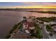 Exclusive waterfront property featuring lush landscaping, a private pool, and stunning bay views at 705 Riviera Dunes Way, Palmetto, FL 34221