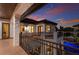 Elegant balcony with iron railing offering views of the pool and manicured landscape at 705 Riviera Dunes Way, Palmetto, FL 34221