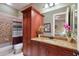 Inviting bathroom featuring a large cabinet for storage and a neutral color scheme at 705 Riviera Dunes Way, Palmetto, FL 34221