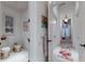 Bright bathroom with a bidet, plantation shutters, and neutral tile flooring at 705 Riviera Dunes Way, Palmetto, FL 34221