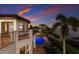 Luxury home with a pool, lush landscaping, and ocean views, perfect for outdoor entertaining at 705 Riviera Dunes Way, Palmetto, FL 34221