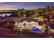 Waterfront home boasts a pool, multi-story design, and luxurious waterfront living with city views, perfect for upscale relaxation at 705 Riviera Dunes Way, Palmetto, FL 34221
