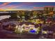 Waterfront home boasts a pool, multi-story design, and luxurious waterfront living with city views, perfect for upscale relaxation at 705 Riviera Dunes Way, Palmetto, FL 34221