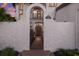 Beautiful wrought iron gate leading to a luxurious residence, promising privacy and elegance at 705 Riviera Dunes Way, Palmetto, FL 34221
