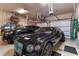Spacious garage showcasing organized storage and housing two luxury vehicles at 705 Riviera Dunes Way, Palmetto, FL 34221