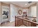 Hallway with hardwood floors and multiple doorways to other rooms at 705 Riviera Dunes Way, Palmetto, FL 34221