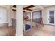 Second floor landing with hardwood floors, decorative railing, and a telescope for enjoying the views at 705 Riviera Dunes Way, Palmetto, FL 34221