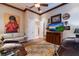 Comfortable living room with modern decor, including a large TV and unique wall art at 705 Riviera Dunes Way, Palmetto, FL 34221