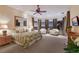 Luxurious main bedroom with sitting area, water views, and elegant furnishings at 705 Riviera Dunes Way, Palmetto, FL 34221