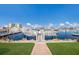 Picturesque marina view with boats docked and waterfront condos, offering a serene and vibrant coastal lifestyle at 705 Riviera Dunes Way, Palmetto, FL 34221
