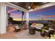 Outdoor seating area featuring comfortable wicker furniture with breathtaking sunset views at 705 Riviera Dunes Way, Palmetto, FL 34221