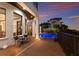 Gorgeous backyard pool area with a brick patio and beautiful sunset views at 705 Riviera Dunes Way, Palmetto, FL 34221