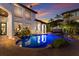 Inviting kidney shaped pool with brick patio and lovely sunset views at 705 Riviera Dunes Way, Palmetto, FL 34221