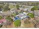 Aerial view showcasing the backyard swimming pool and hot tub along with an exterior garage and nearby highway at 8376 Sycamore Dr, New Port Richey, FL 34654