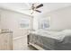 Cozy bedroom with natural light and plush carpeting at 8376 Sycamore Dr, New Port Richey, FL 34654