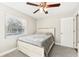 Bedroom with a bed, a ceiling fan, and one window at 8376 Sycamore Dr, New Port Richey, FL 34654