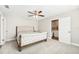 Bright bedroom with a ceiling fan and a bed with direct access to ensuite bathroom at 8376 Sycamore Dr, New Port Richey, FL 34654