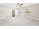 Spacious bedroom features natural light, neutral tones, and ceiling fan at 8376 Sycamore Dr, New Port Richey, FL 34654