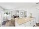 Open-concept living space with kitchen bar and view into the living room, perfect for gathering and entertaining at 8376 Sycamore Dr, New Port Richey, FL 34654
