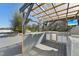 Inviting outdoor kitchen with a bar, grill, and outdoor television at 8376 Sycamore Dr, New Port Richey, FL 34654