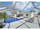 Relaxing backyard pool area with a clear view of the sun and surrounding trees at 8376 Sycamore Dr, New Port Richey, FL 34654