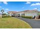 Exterior view of the clubhouse with manicured landscaping at 10142 44Th N Way, Pinellas Park, FL 33782