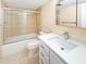 Bathroom with tile flooring, shower/tub combo, vanity, and modern fixtures at 10346 Carrollwood Ln # 171, Tampa, FL 33618