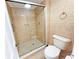 Bathroom featuring tile flooring, glass enclosed shower, and modern fixtures at 10346 Carrollwood Ln # 171, Tampa, FL 33618