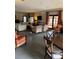 Spacious common area featuring ample seating, a TV, and large windows for natural light at 10346 Carrollwood Ln # 171, Tampa, FL 33618