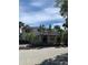 Exterior view of the condo with an entrance and tropical landscaping at 10346 Carrollwood Ln # 171, Tampa, FL 33618